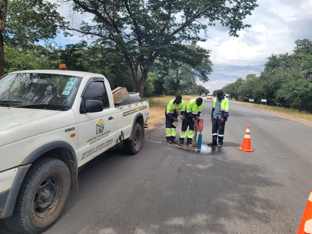 Lawnlink technicians sampling a road pavement